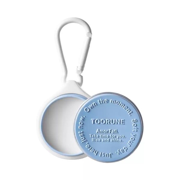 Single Product Open Lid Detail View Light blue TOORUNE solid perfume open lid detail shot, embossed letter slogan on lid surface, sturdy carabiner hook and inner container craft close-up